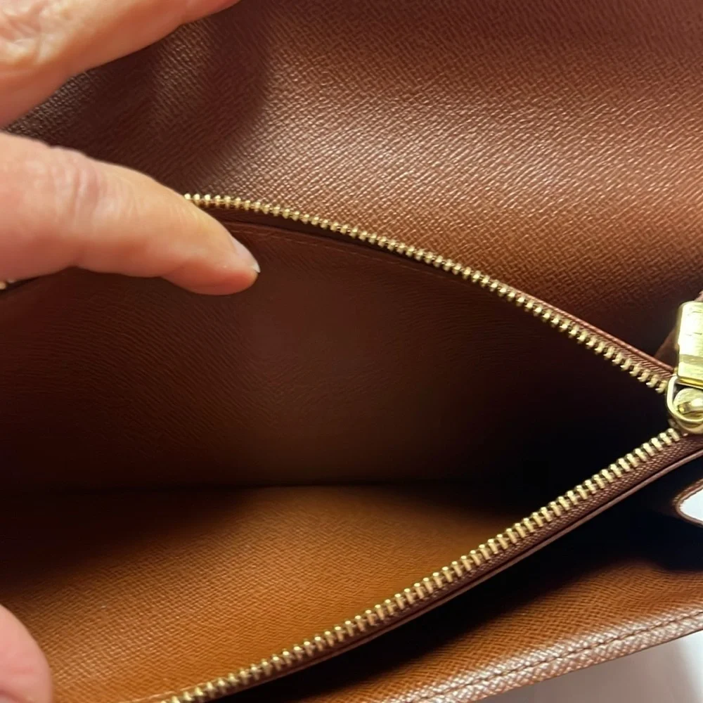 Louis Vuitton monogram sara long wallet.